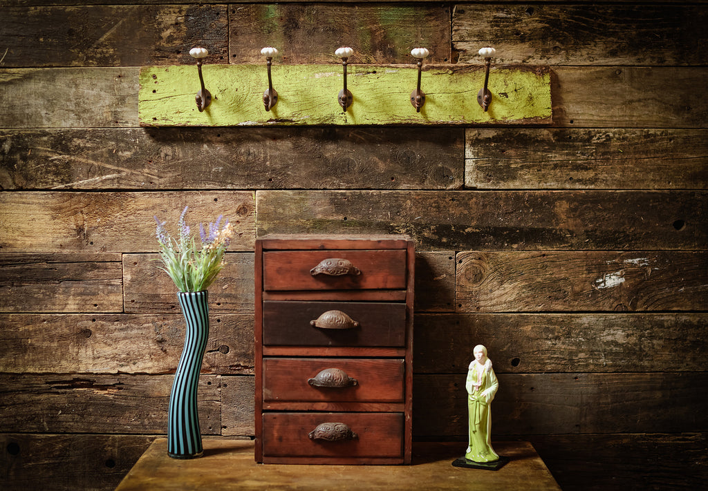 Vintage coat hooks on greed wood