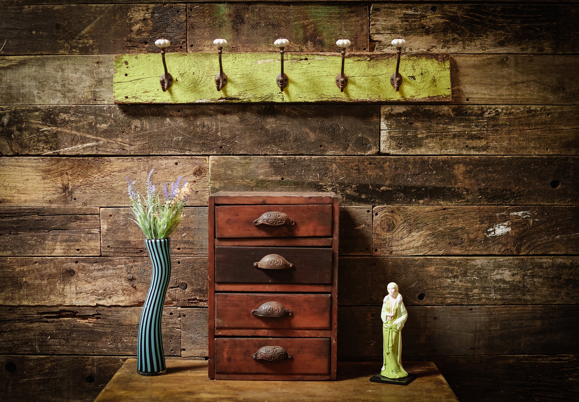 Vintage coat hooks on greed wood